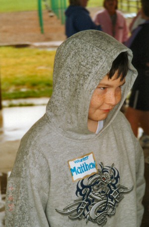 In spite of the wind, rain and dreary skies,  Matthew manages to smile.