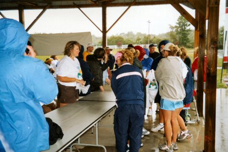 Day-of registration gets under way, with wind and rain.